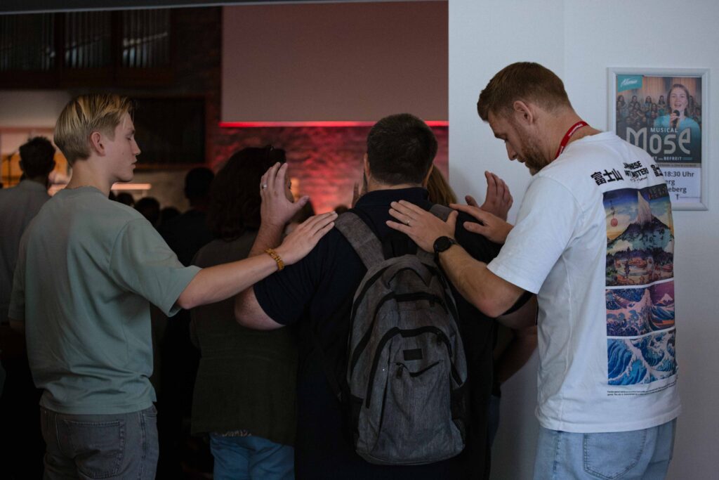 Photo of someone getting prayed for